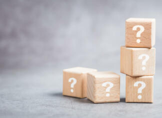 #kviz Kateri poklic ti je namenjen? Many question mark wood cubes, FAQs (Frequently Asked Questions), marketing plan or education cocncept