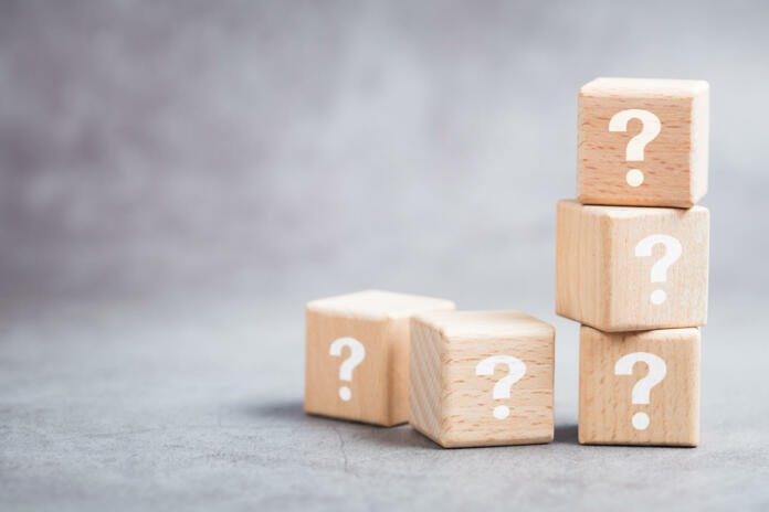 Many question mark wood cubes, FAQs (Frequently Asked Questions), marketing plan or education cocncept