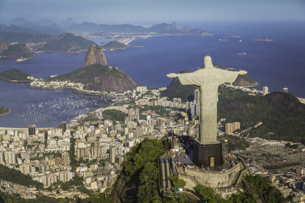 Rio De Janeiro, Brazil - February 11, 2015: Rio de Janeiro, Brazil : Aerial view of Christ and Botafogo Bay from high angle. Statue is located on Corcovado Hill and is facing the city and Guanabara Bay.