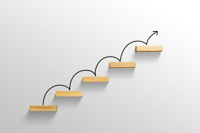rising arrow on staircase, increasing business