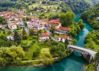 Turistični bon v Posočju Riverside Most na Soci Picturesque Town in Slovenia.