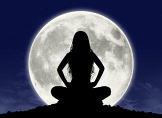 Ali polna Luna vpliva nate? silhouette of a young beautiful woman with long hair in meditation posture with the full moon on the background, some graphics are provided by Nasa