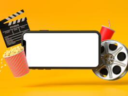 Smartphone blank screen with popcorn, film strip, clapperboard and drink on yellow background. oncept of online movie viewing. 3D rendering, 3D illustration