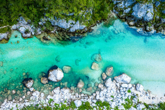 Soca River in Slovenia. Beautiful Aerial of turquoise Mountain River.