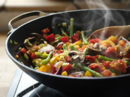 steaming mixed vegetables in the wok, asian style cooking vegetarian and healthy, selected focus, narrow depth of field