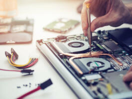 technician repairing laptop computer closeup