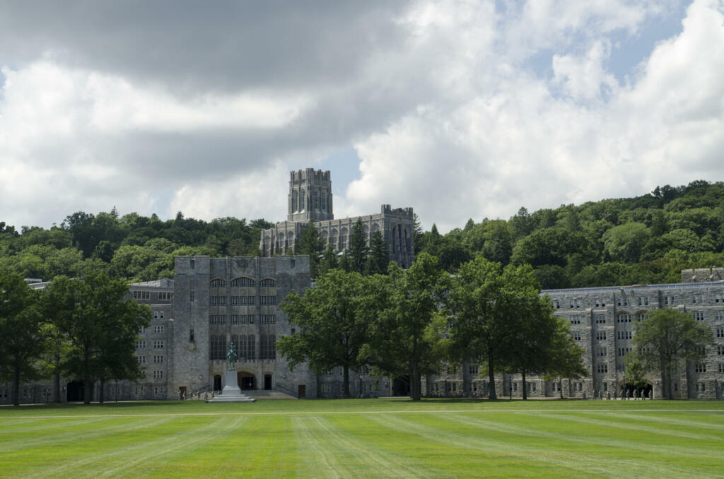 The Military Academy at West Point, New York. Parade grounds in foreground with Washington Mess Hall and Cadet Chapel in distance.