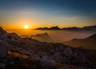 Velik uspeh Slovenije v reviji National Geographic Triglav national park sunlit mountains peaks, Soca Trenta valley forest view, backpacking, hiking Slovenia nature, travel Europe.