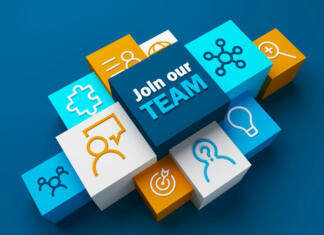 Trg dela 3D render of JOIN OUR TEAM business concept with symbols on colorful cubes on dark blue background