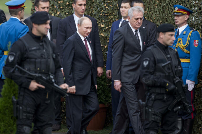 Belgrade, Serbia - October 16, 2014: Russian President Vladimir Putin and Serbian President Tomislav Nikolić  during the military parade "March of the victorious" in Belgrade. President Vladimir Putin of Russia arrived in Belgrade to commemorate the city’s liberation by the Red Army and Yugoslav Partisans in 1944. during World War II.