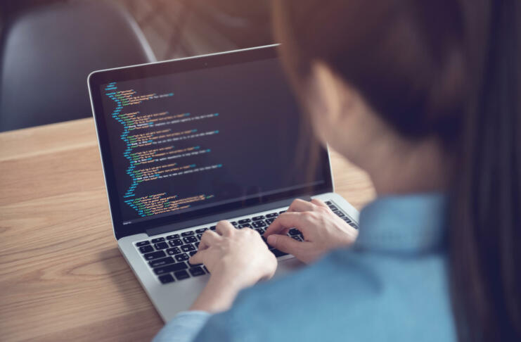 Closeup coding on screen, Woman hands coding html and programming on screen laptop, development web, developer.