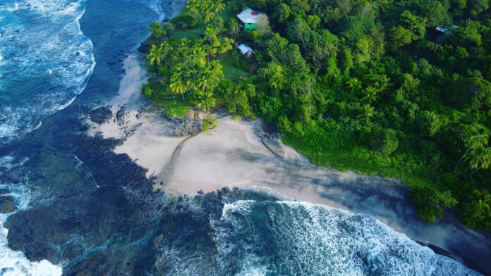 Drone view of a little white sandy beach in the Pacific coast of Costa Rica, near Junquillal