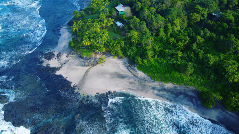 Drone view of a little white sandy beach in the Pacific coast of Costa Rica, near Junquillal
