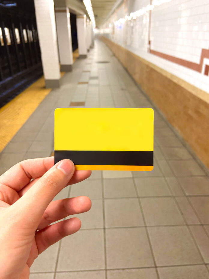 Holding MetroCard at the train station. Blank Card