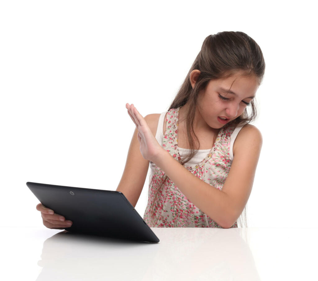 I don´t want to see that! Parental Control. Pre-teen girl with a tablet pc