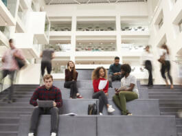 Interior Of Busy University Campus Building With Students