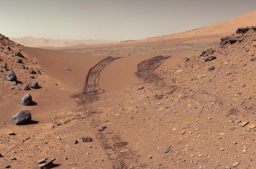 Landscape on Planet Mars. Rover after crossing a dune. Elements of this picture furnished by NASA.