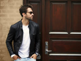 Leather dude in sunglasses, looking away