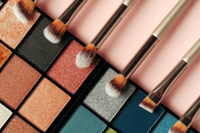 Make-up palette and brushes. Professional eyeshadow palette. Close up.