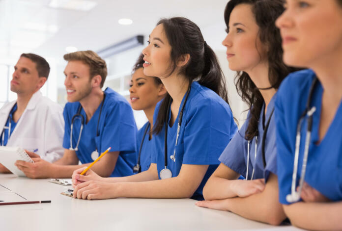 Medical students listening sitting at desk at the university