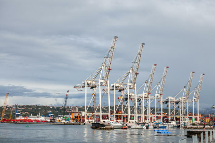 Picture of the panorama of Luka koper, the port of koper, with industrial cranes. Port of Koper is a public limited company, which provides port and logistics services in the only Slovenian port, in Koper. It is situated in the northern part of the Adriatic Sea, mainly connecting markets of Central and Southeast Europe with the Mediterranean Sea and Far East. Unlike other European ports, which are managed by port authorities, the activities of Port of Koper comprise the management of the free zone area, the management of the port area and the role of terminal operator. It is currently the main port that serves the route between Adriatic sea and Central Europe.