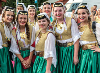 Sevdah ali sevdalinka Sarajevo, Bosnia and Herzegovina - July 28, 2015: USA folklore ensemble KUD Derdan perform live at Trg djece Sarajeva