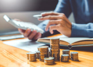 Kam, za koliko denarja? Saving money concept Man hand putting Row and coin Write Finance Saving money concept Man hand putting Row and coin Write Finance