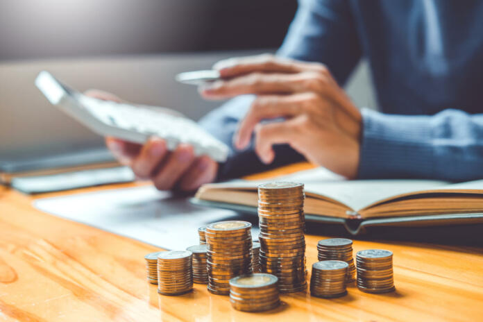 saving-money-concept-man-hand-putting-row-and-coin-write-finance-saving-money-concept-man-hand-putting-row-and-coin-write-finance-stockpack-istock Saving money concept Man hand putting Row and coin Write Finance Saving money concept Man hand putting Row and coin Write Finance