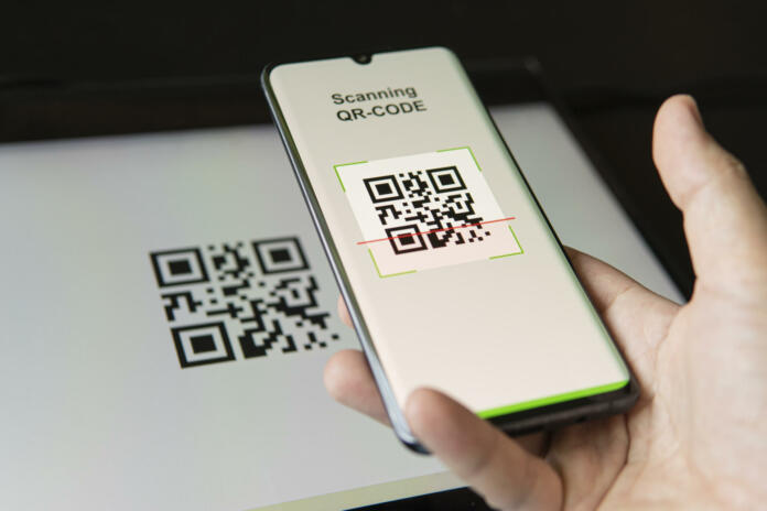 Scanning QR code with mobile smart phone. all the graphics on the screen are made up. checking the qr code on the mobile phone.