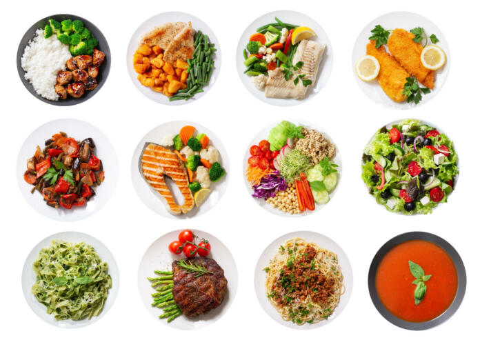 set of plates of food isolated on a white background, top view