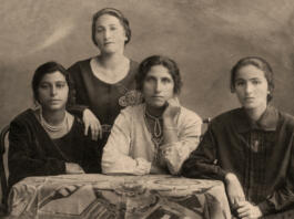 A vintage photo portrait from 1914 of Gypsy family.