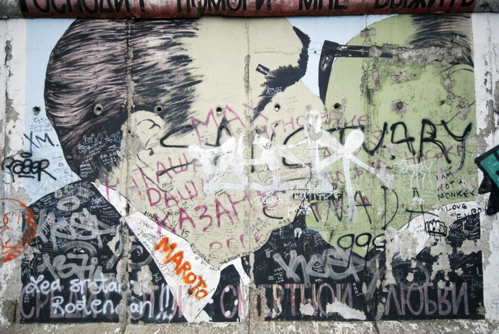 "Berlin, Germany - February 13 2009: Part of "East Side Gallery" on the largest (1,3 km) and best kept segment of the Berlin Wall, just before overall wall restoration."