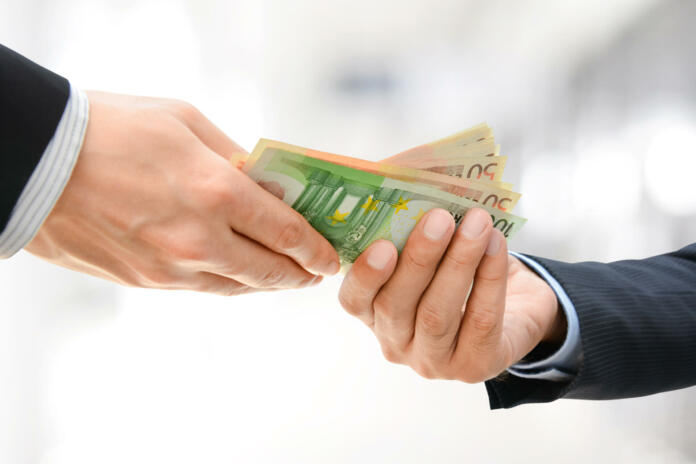 Businessman hands passing money, Euro currency (EUR), on white gray background