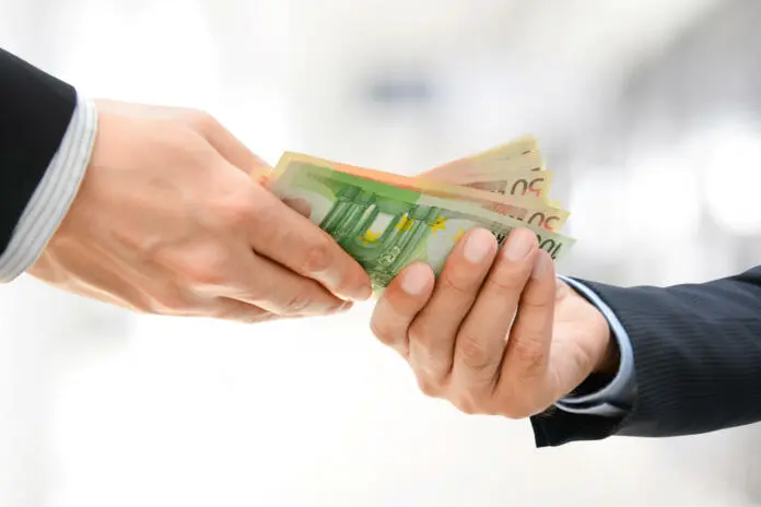 businessman-hands-passing-money-euro-currency-eur-on-white-gray-background-stockpack-istock Businessman hands passing money, Euro currency (EUR), on white gray background