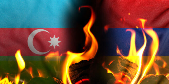 Conceptual photo with the flags of Azerbaijan and Armenia during the aggravation of relations between them 2021.
