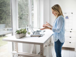 Ergonomic woman standing posture when using a computer