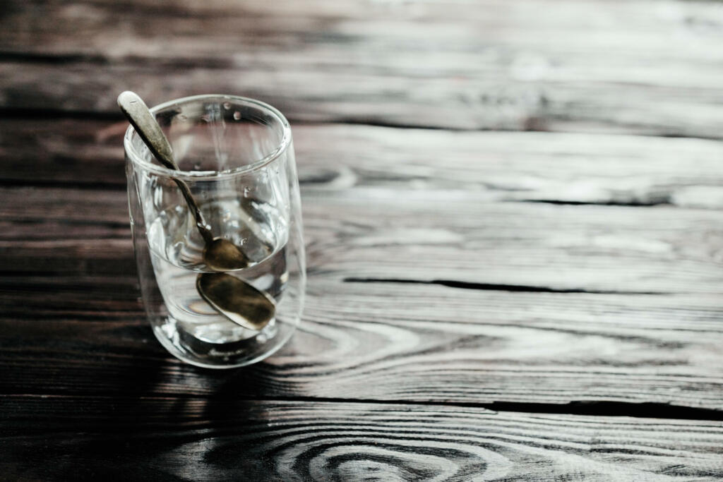 Glass of water on a wooden background