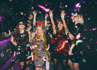 Maturantski izleti Group of friends having fun for new year's eve in a club. Drinking and dancing together
