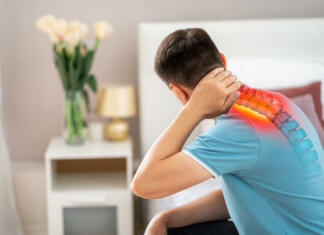 Uspešno nad bolečine v vratu in ramenih! Hernia of the cervical spine, neck pain, man suffering from ache in the bedroom, compression injury of the intervertebral disc, health problems concept