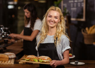Kakšne so moje pravice, če kot študent odprem s. p.? Pretty waitress holding a tray with sandwiches at the coffee shop