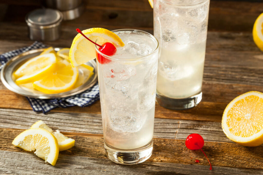 Refreshing Classic Tom Collins Cocktail with a Cherry and Lemon Slice