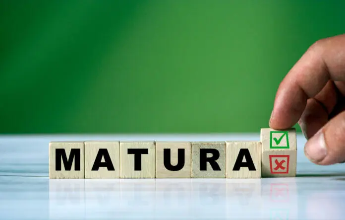the-hand-turns-the-wooden-cube-and-changes-the-polish-word-matura-english-secondary-school-certificate-with-green-positive-tick-check-box-and-red-reject-x-check-box-stockpack-istock The hand turns the wooden cube and changes the polish word MATURA (english = secondary school certificate) with green positive tick check box and red reject X check box.