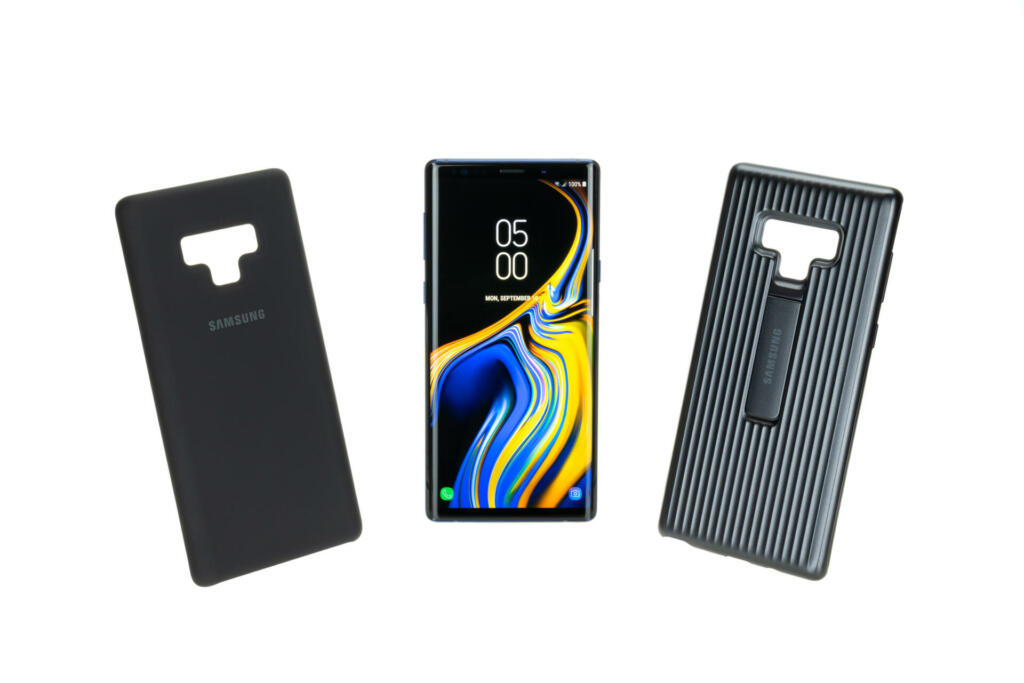 Bangkok, Thailand - Sep 12, 2018: Studio shot of new Samsung Galaxy Note 9 smartphone with protective standing cover and silicone case accessories, isolated on white background. Illustrative editorial