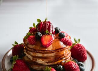 brown and red strawberry cake on white ceramic plate