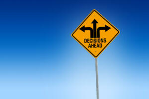 Descisions ahead road sign in warning yellow with blue background, - Illustration