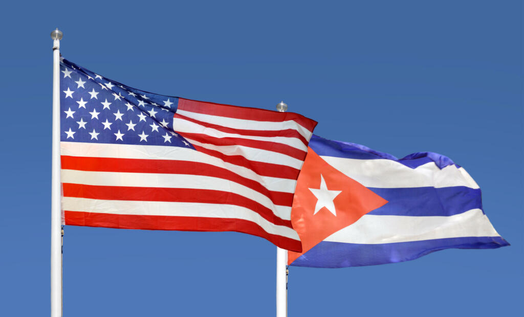 Flag USA and Cuba isolated on sky background