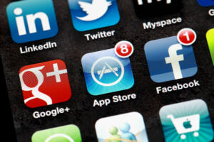 "Hong Kong, China - March, 19 2012: A close-up of an Apple iphone screen with applications of Twitter, Linkedin, Google Plus, Facebook, and App Store."