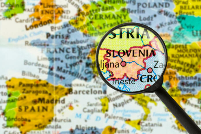 map of Republic of Slovenia through magnifying glass