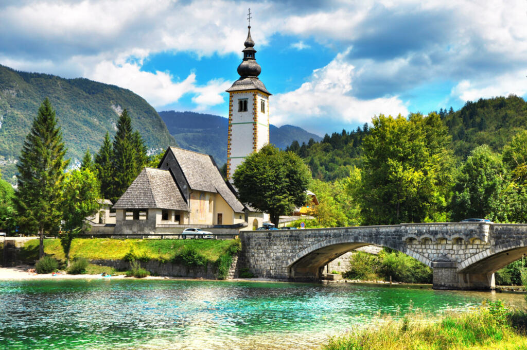 Bohinj Lake, Church of St John the Baptist with bridge. Triglav National Park, Julian Alps, Slovenia.