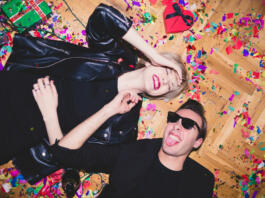 New Year's / Birthday Party. Girl and boy laying on the floor full of confetti
